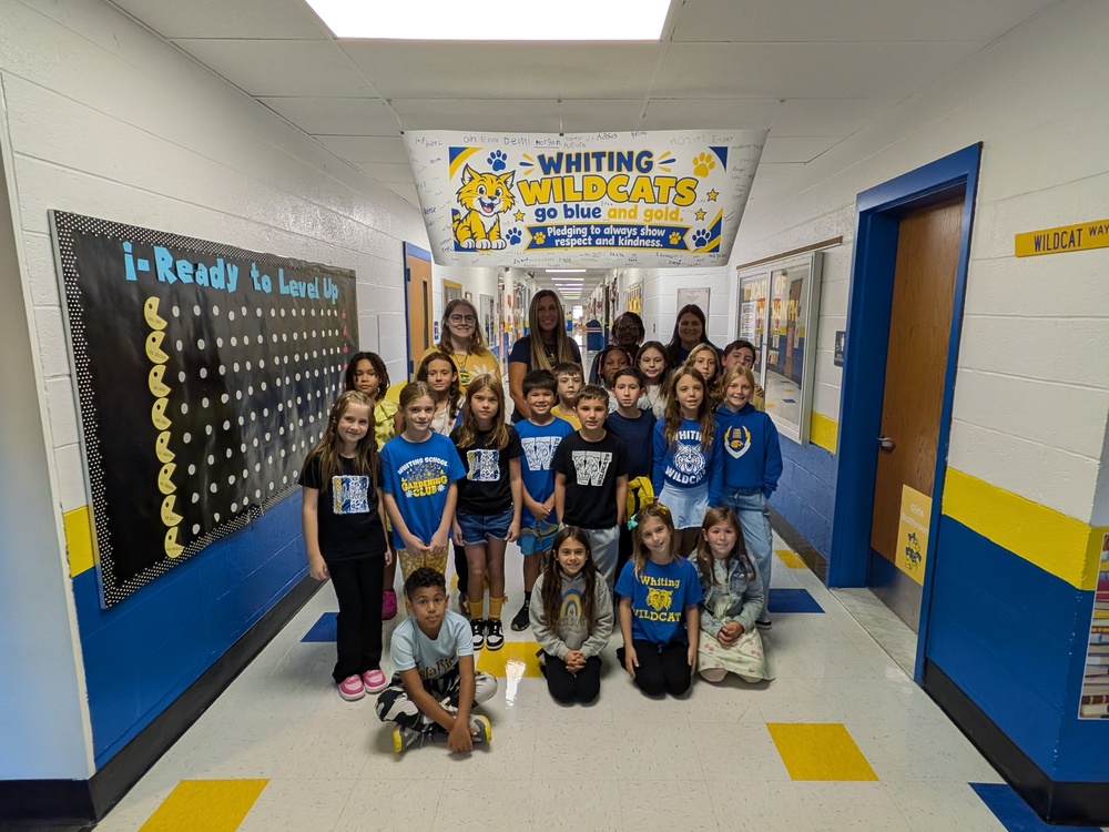 Whiting Wildcats stand under their banner for the Week of Respect