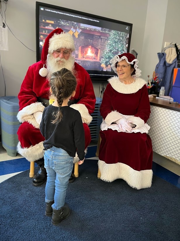 Holiday magic filled Manchester Township Elementary School this morning as Santa and Mrs. Claus, joined by Vice Principal Johnston, visited kindergarten and preschool classrooms. Students enjoyed cookies and milk, shared wish lists, and learned they are on the nice list.