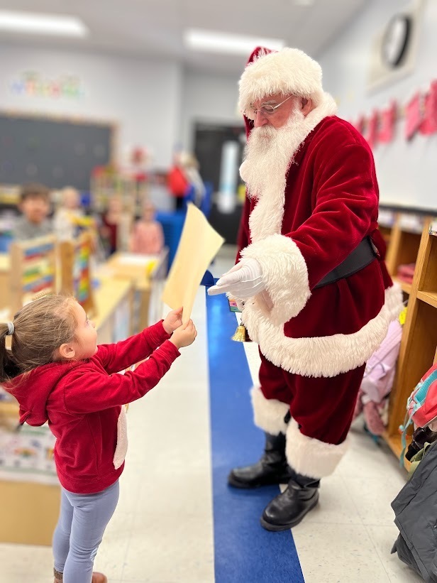 Holiday magic filled Manchester Township Elementary School this morning as Santa and Mrs. Claus, joined by Vice Principal Johnston, visited kindergarten and preschool classrooms. Students enjoyed cookies and milk, shared wish lists, and learned they are on the nice list.