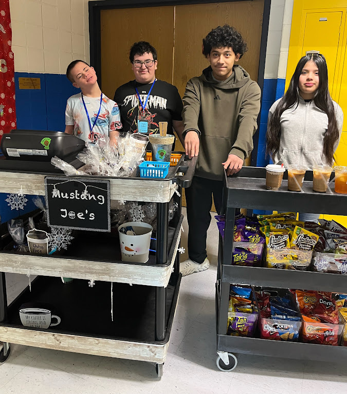 Students in the MTMS small group instructional class deliver coffee, treats, and smiles each Thursday! With handcrafted drinks, homemade baked goods, and their cheerful greeting, “Mustang Joe’s is here, we’re going to bring you cheer!” they’re building real-world skills and spreading positivity!