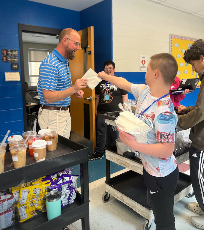 Students in the MTMS small group instructional class deliver coffee, treats, and smiles each Thursday! With handcrafted drinks, homemade baked goods, and their cheerful greeting, “Mustang Joe’s is here, we’re going to bring you cheer!” they’re building real-world skills and spreading positivity!