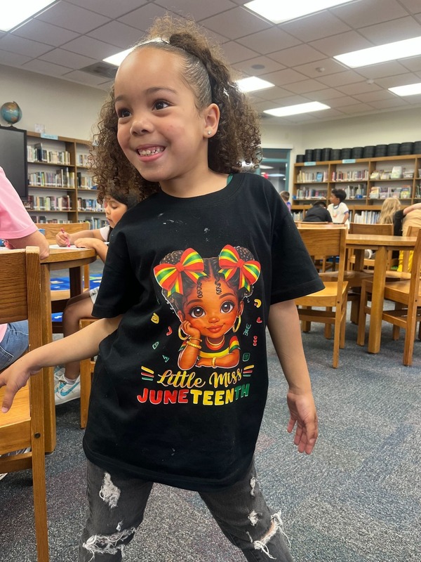 A student shows off her Juneteenth shirt!