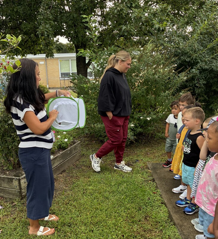 Students releasing butterflies into the wild