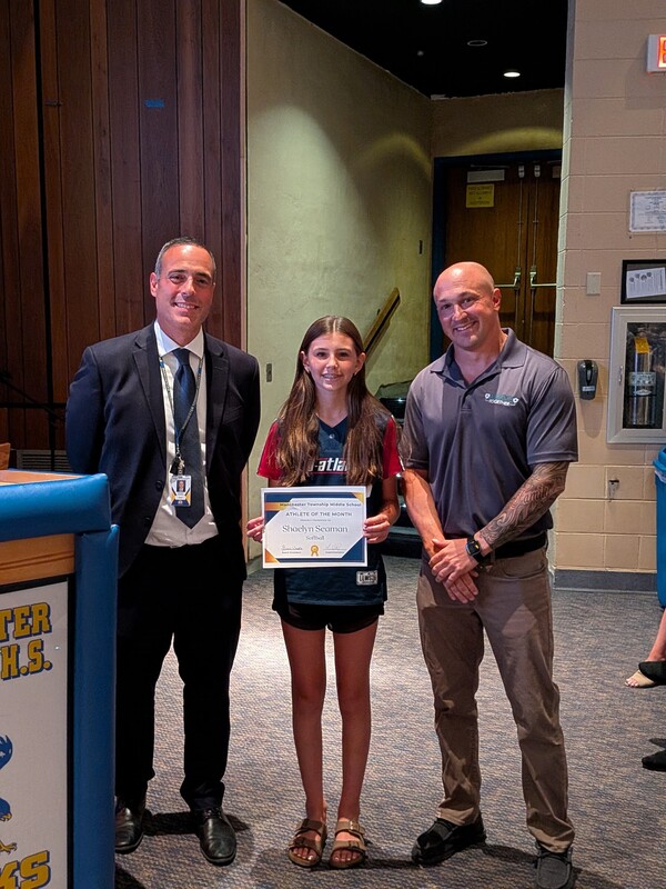 Shaelyn accepting a recognition certificate