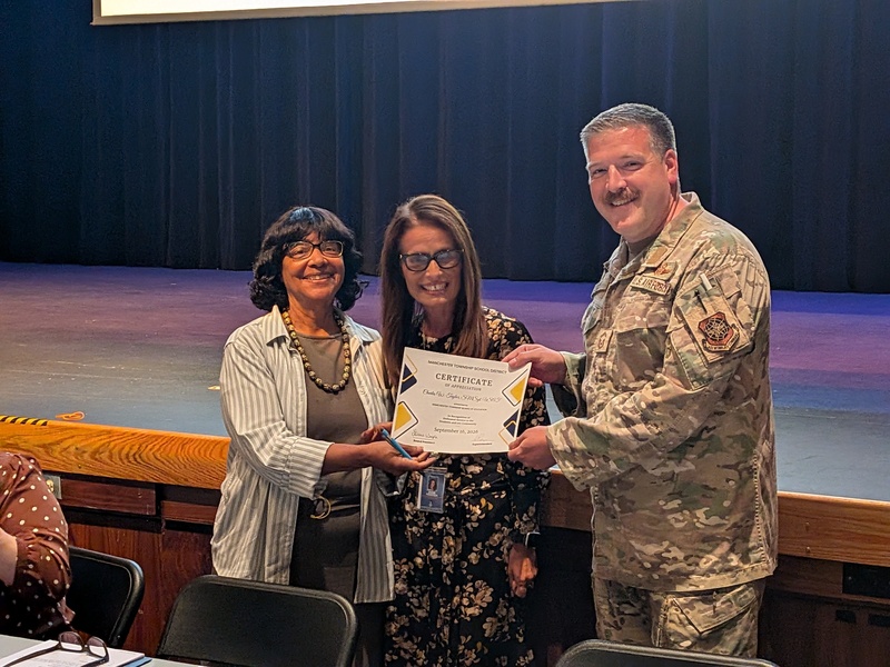 MSgt Taylor accepting certificate of recognition