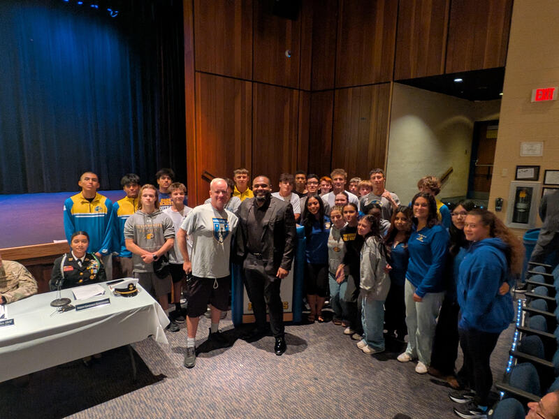 Students standing with Jimmy Lawson