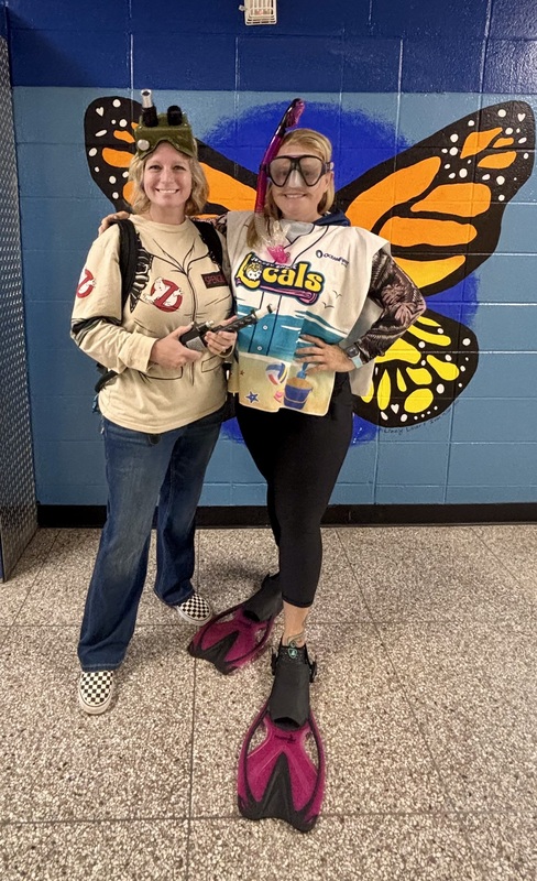 Staff members wearing atypical outfits for Tuesday's theme