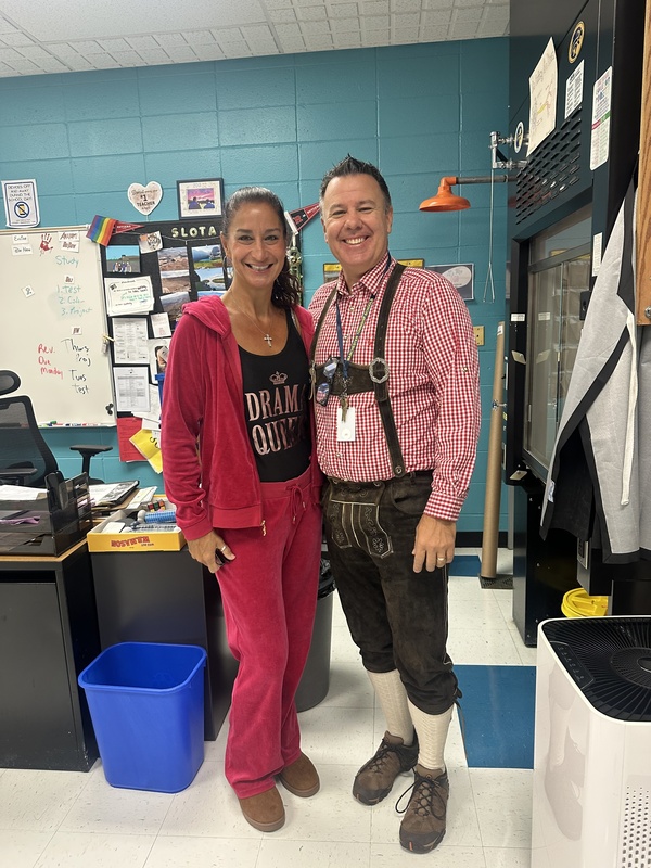 Staff members wearing atypical outfits for Tuesday's theme