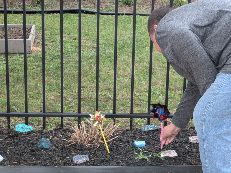 A student planting his pinwheel