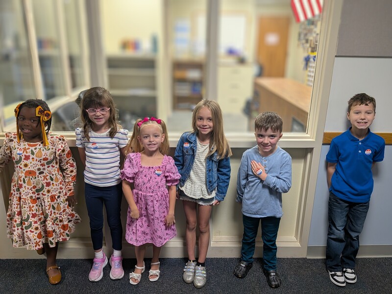 Students with "I Voted" stickers