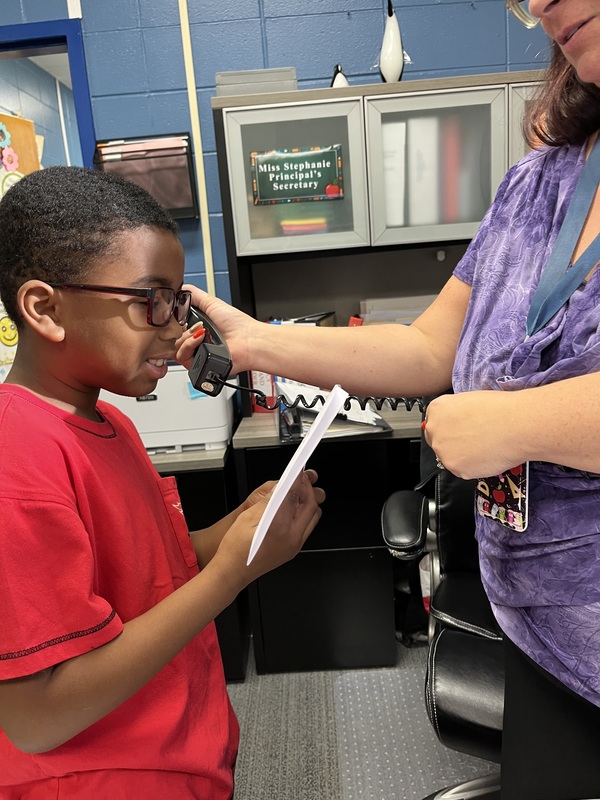 A student reads his speech for RDS student council