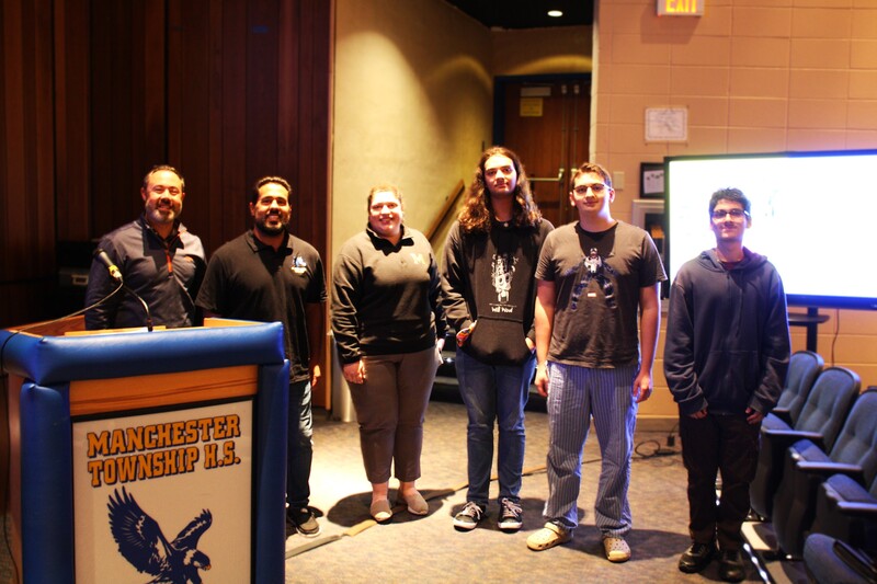 MTHS Esports Senior Members receiving recognition at the BOE meeting