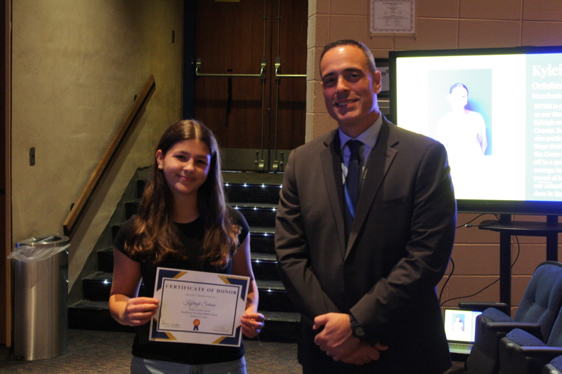 MTMS student of the month receiving recognition at the BOE meeting