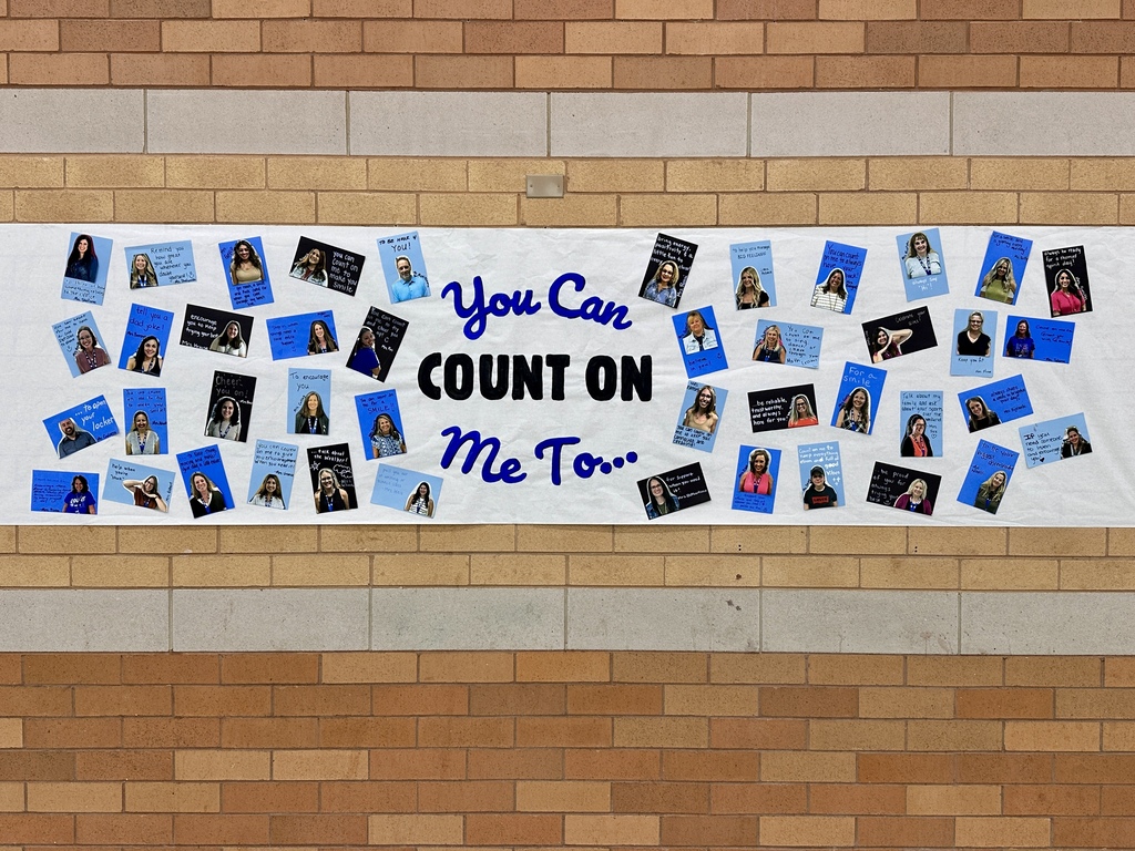 A horizontal banner with photos and text on a brick wall. The banner reads "You Can Count On Me."