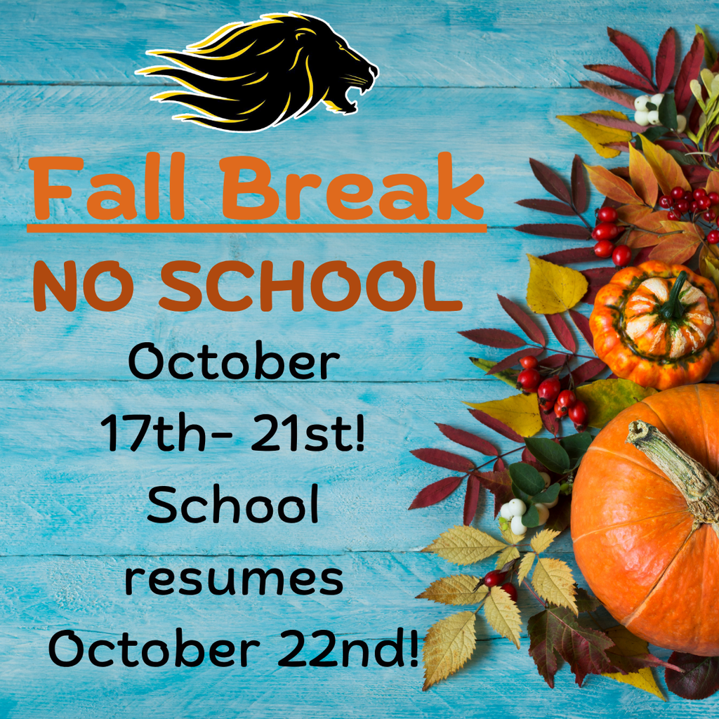 Blue wooden background with fall arrangement of pumpkins and leaves on right side.