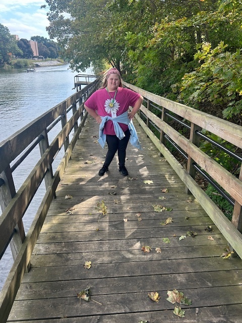 Student standing on a dock