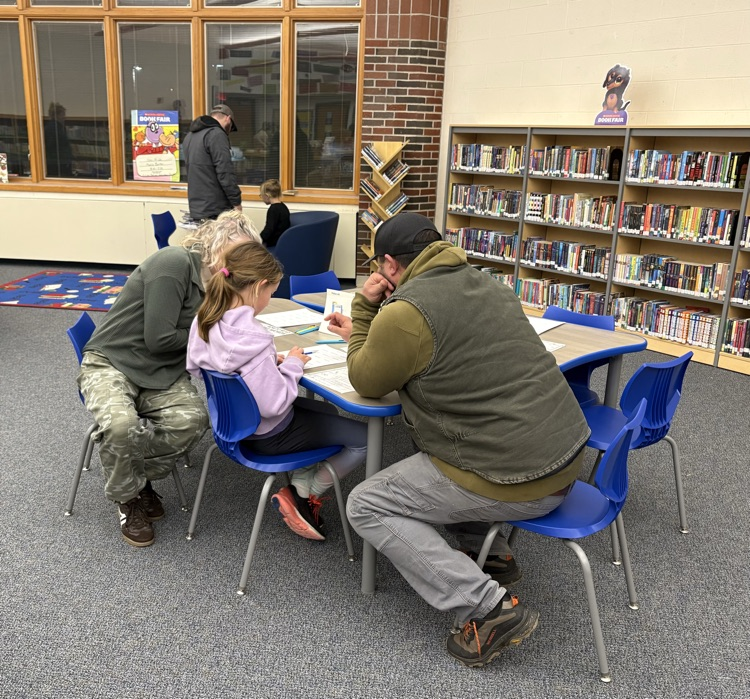 parents and their children enjoy a station
