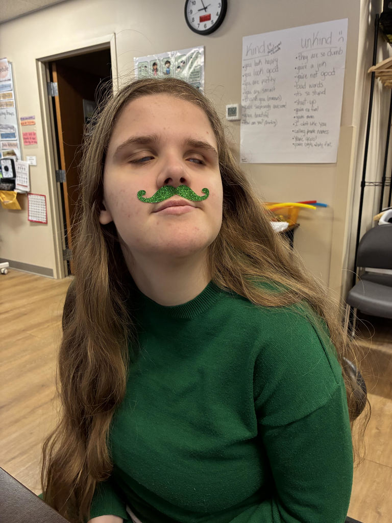 Student in a. green shirt