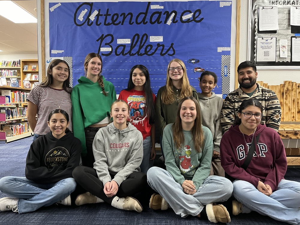 High School students wiht perfect attendance are pictured outside the school library.