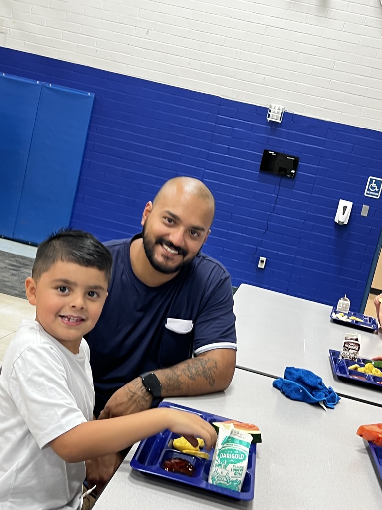 Juan Picazo and son have lunch.