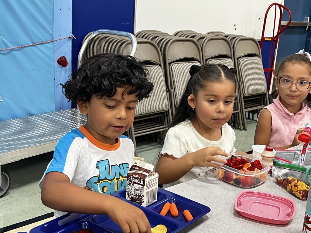 Three students eating lunch.