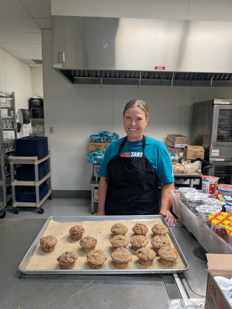 Secondary Cook Kelly Gosvenor with a batch of blueberry muffins.
