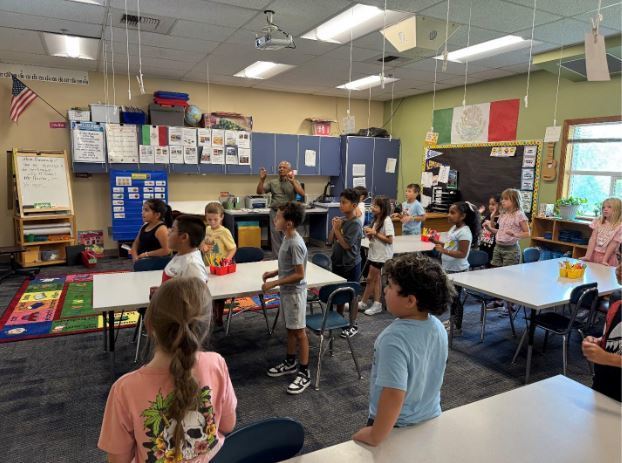 Mr. Benivedes and students.