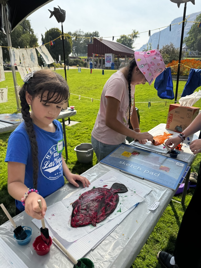 Girls painting salmon