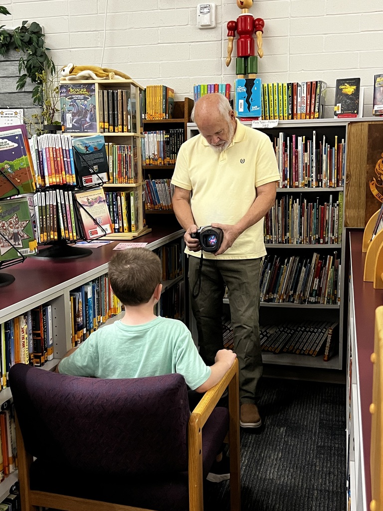 Boy getting vision checked.