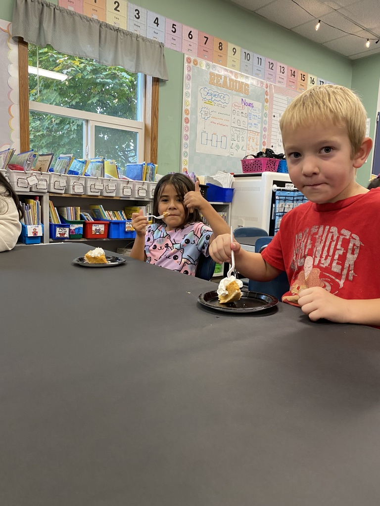 First graders eating pies.