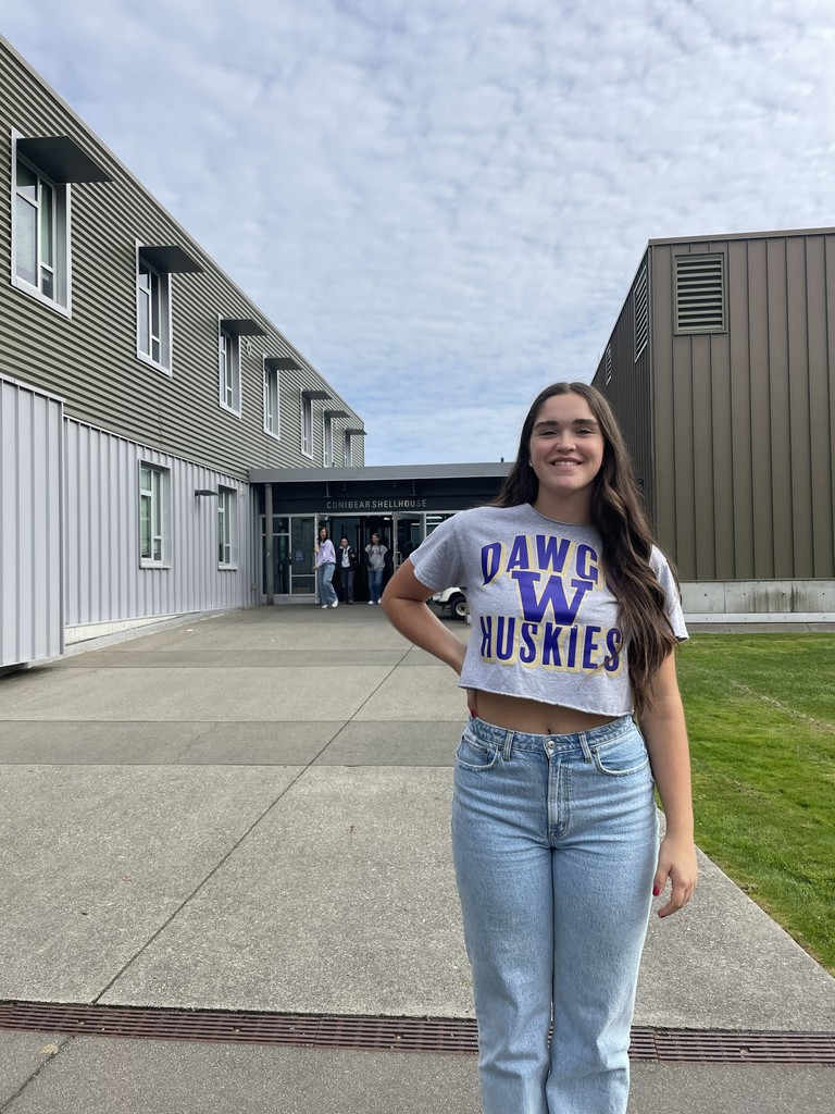 Camille Hutton stands in front of the boat house at the University of Washington.