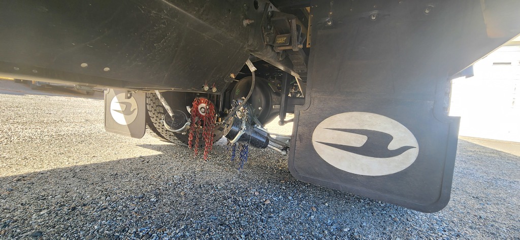 Drop down chains beneath a bus.