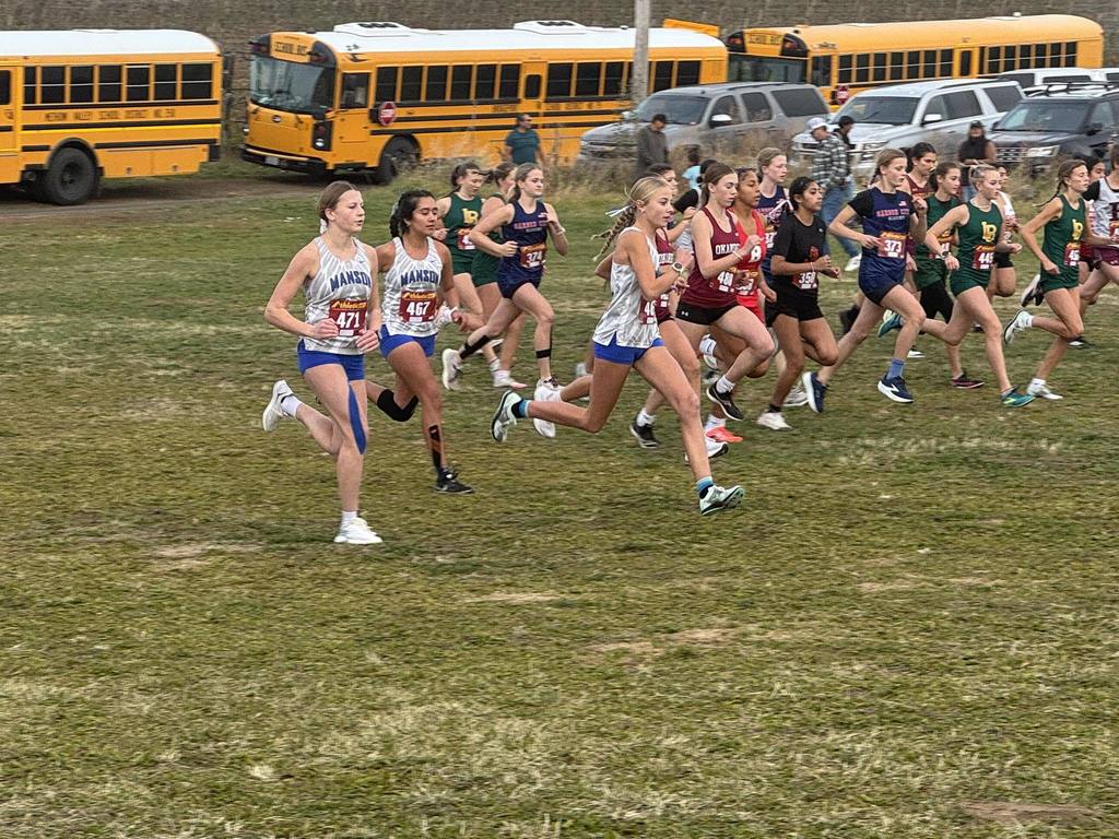 Girls Cross COuntry team runngin at district meet.