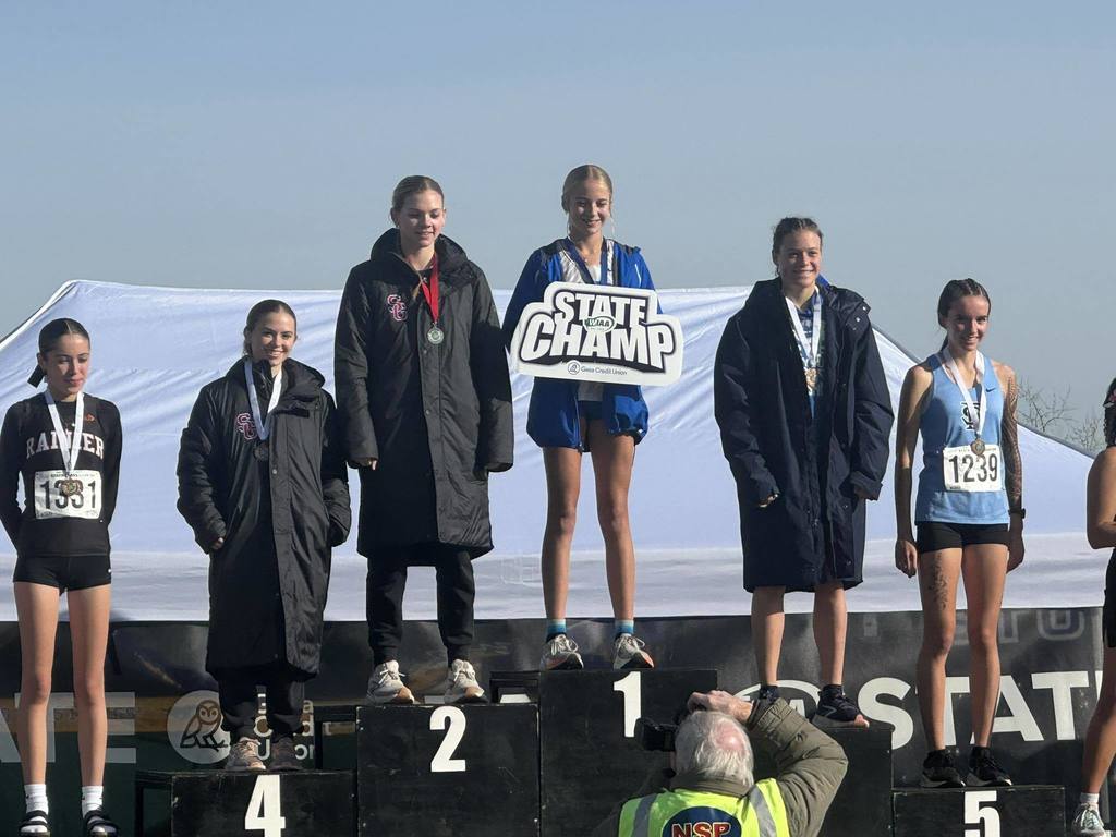 Grace Walsh hold state champion sign.