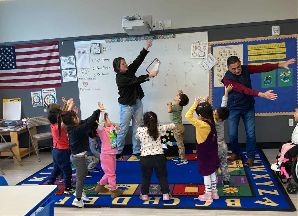 Students act out solar system stories with Manson librarian.
