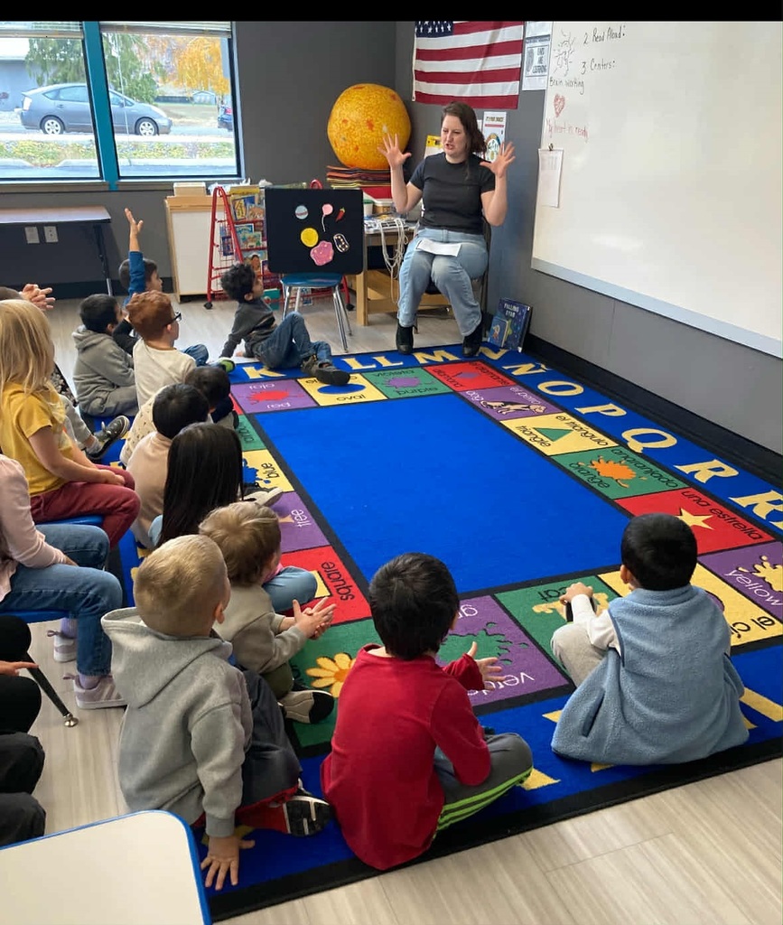 Students listen to a story told by the Manson librarian.