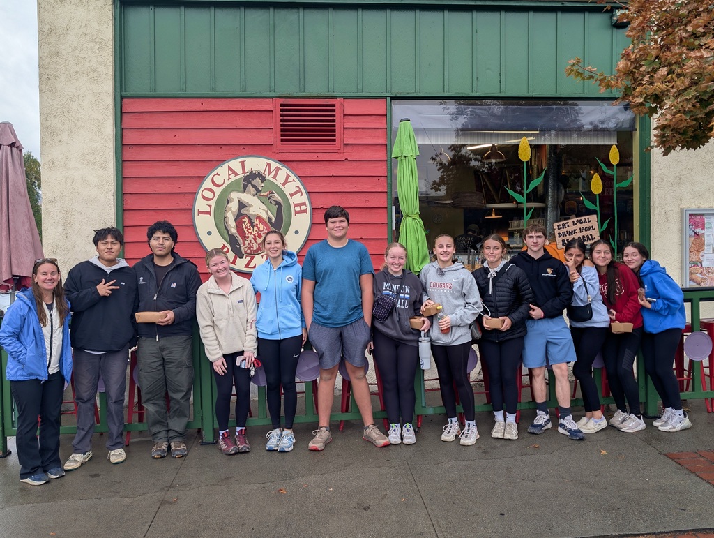 Manson students in front of Local Myth Pizza.