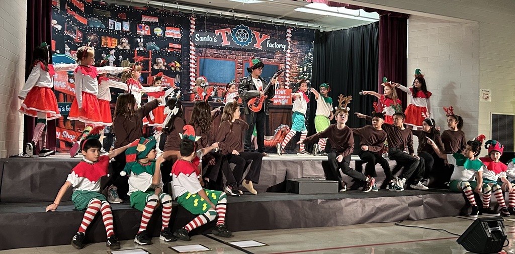 Cast of Elves on stage.