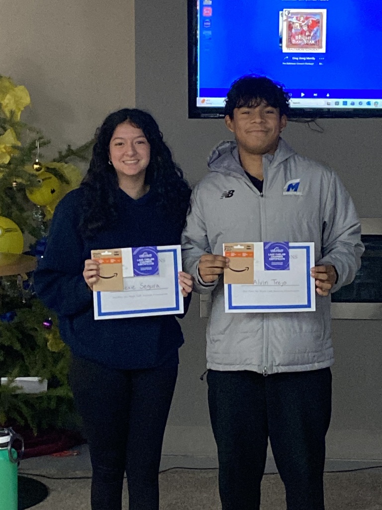 Second place Shark Tank winners with their awards.