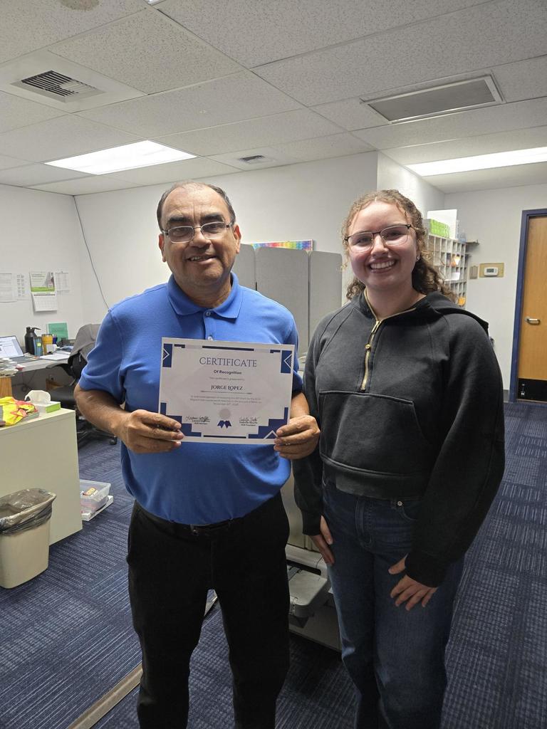 Mr. Lopez holds his G3 award.