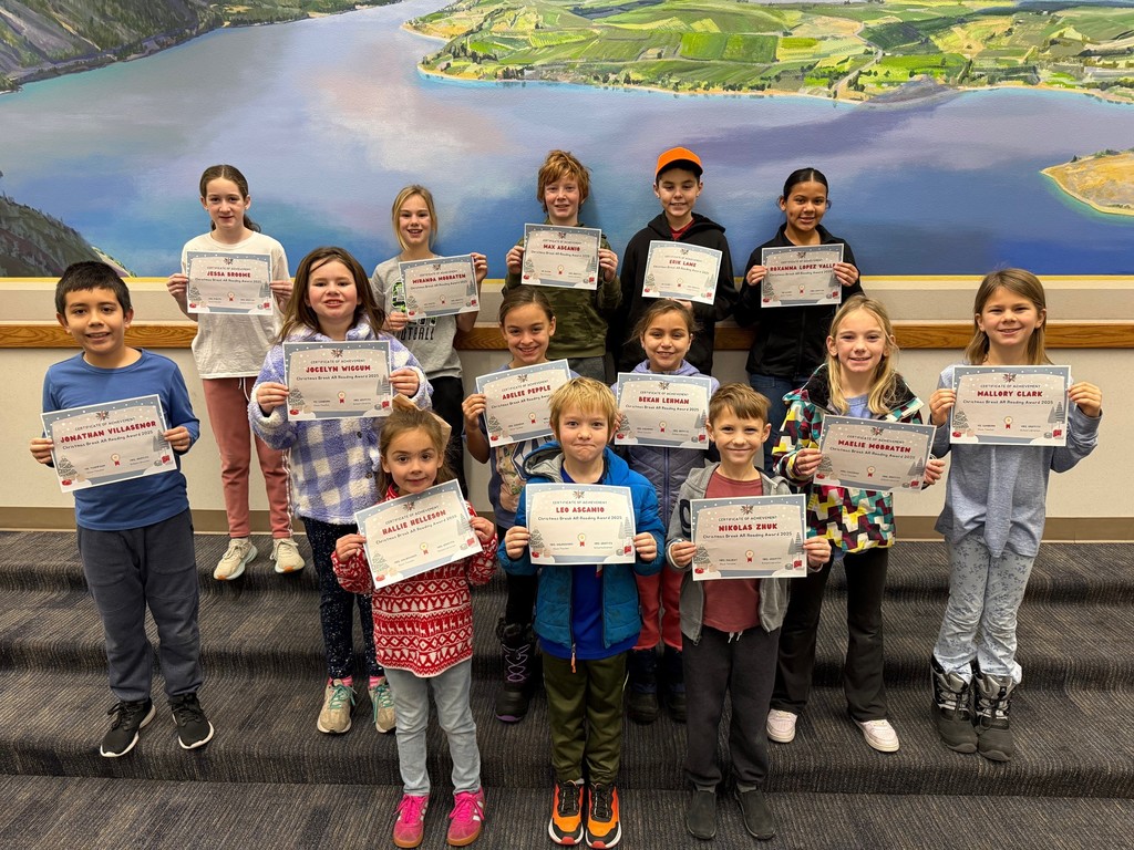 Students show awards for reading over Christmas Break.
