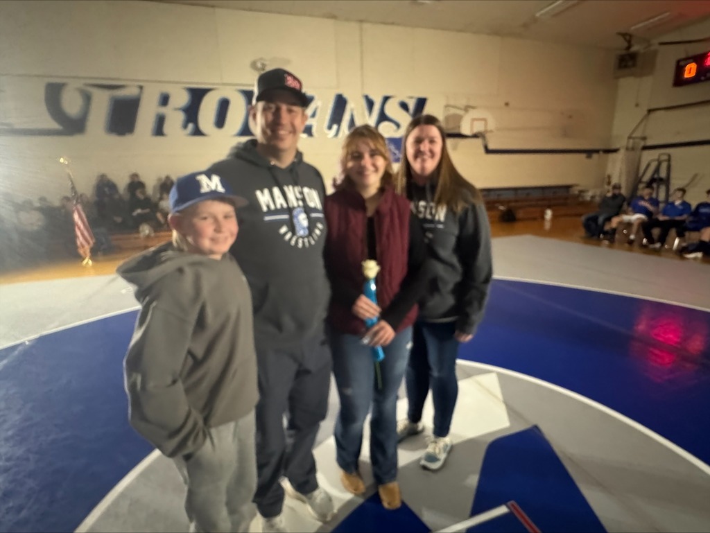 The senior wrestling manager is honored on senior night in the gym.