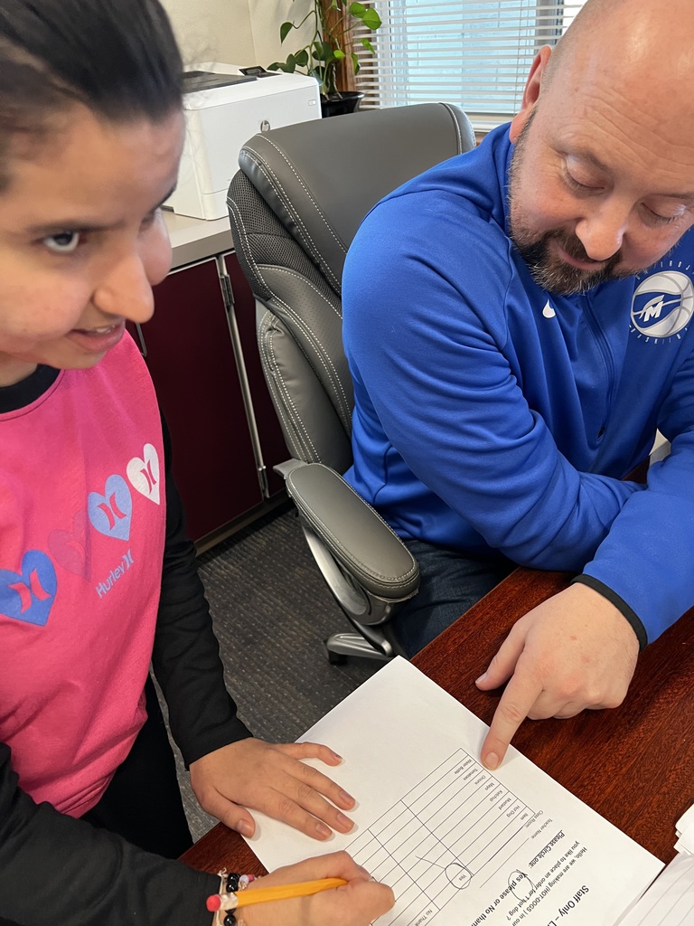 Principal Riippi places a hotdog order with a student.