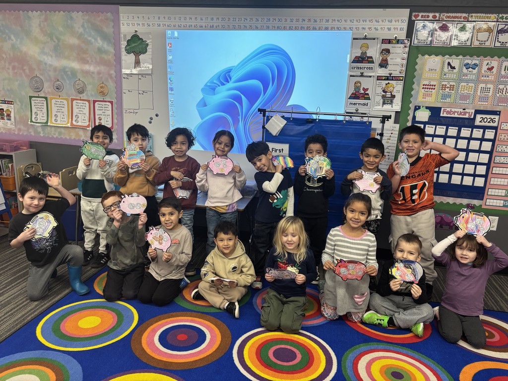 TTK students pose with their paper piggy banks.