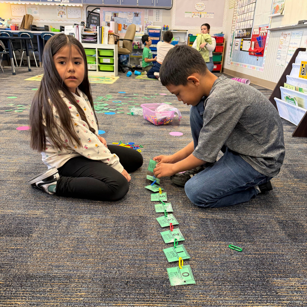 First grade students participating in 100th day of school activities