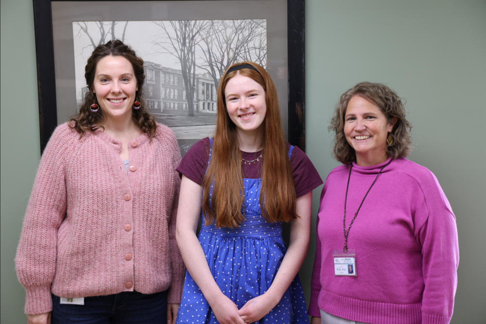 Image of counselor and principal with UVM green and gold recipient
