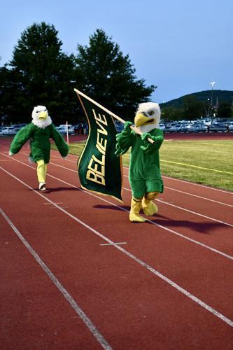 Believe banner and mascots at soccer game