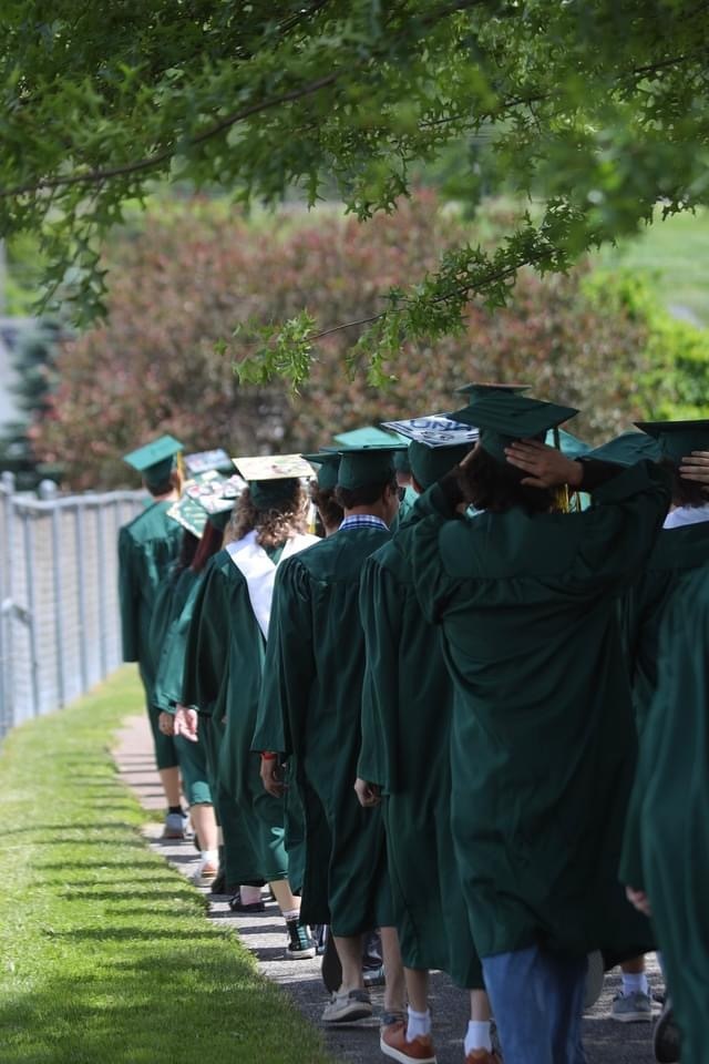 Image of graduation caps and gowns