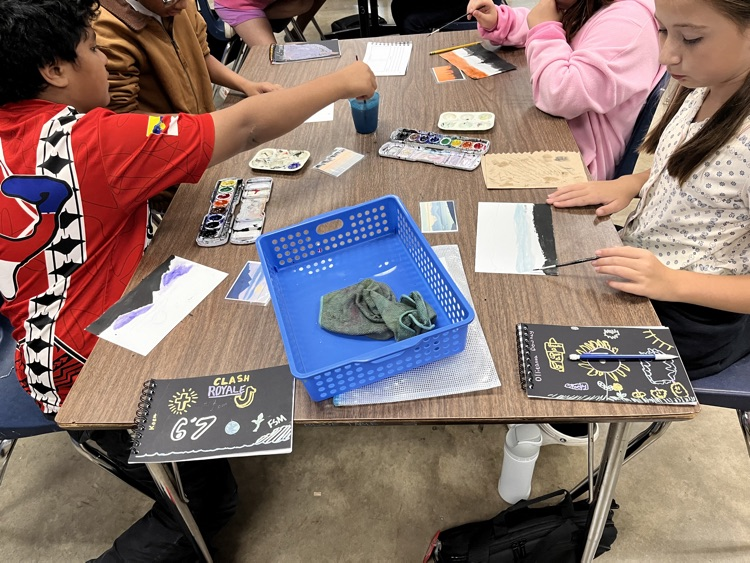 5th graders painting their atmospheric perspectives.