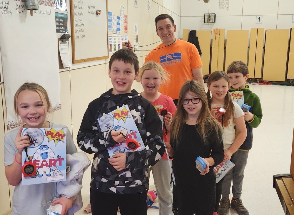 Grade 3 with PE teacher, Mr. Lajoie, showing thier winter kids gear. 